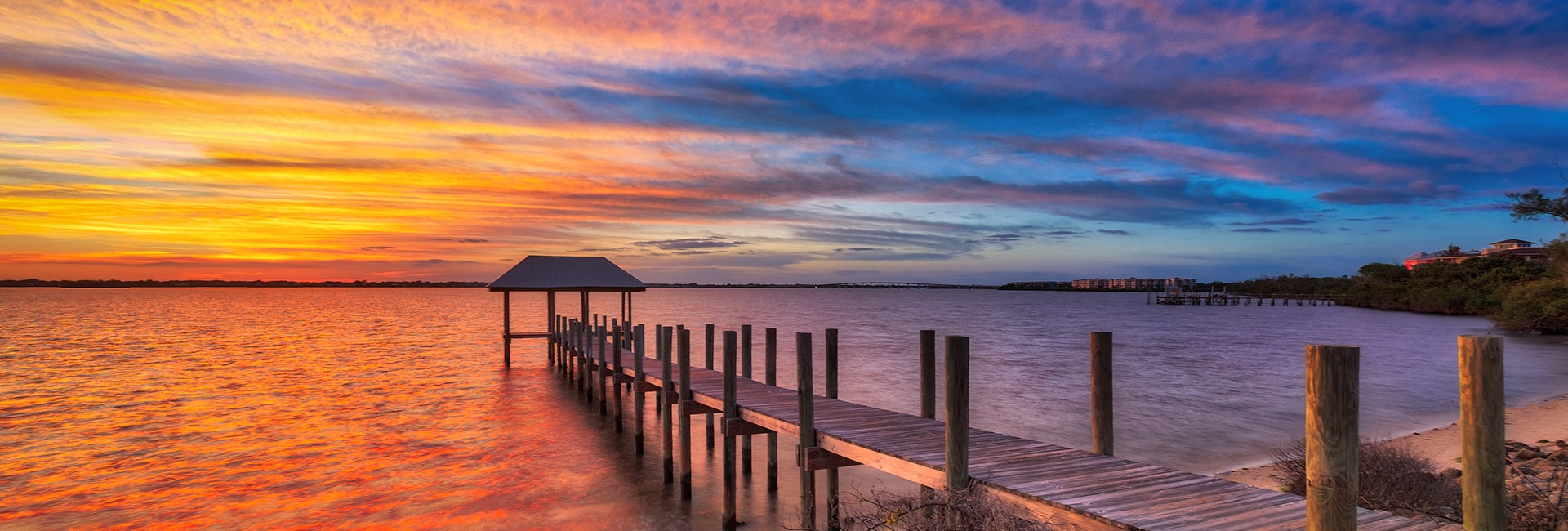 orange and blue skies on the intracoastal of hutchinson island