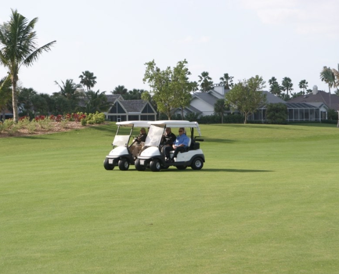 men on golf carts at the Jack Nicklaus Golf Course Reopening