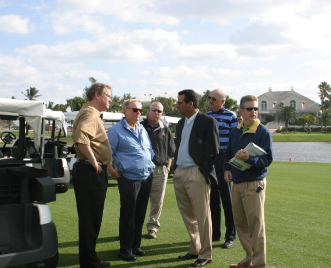 group of men on the jack nicklaus golf course