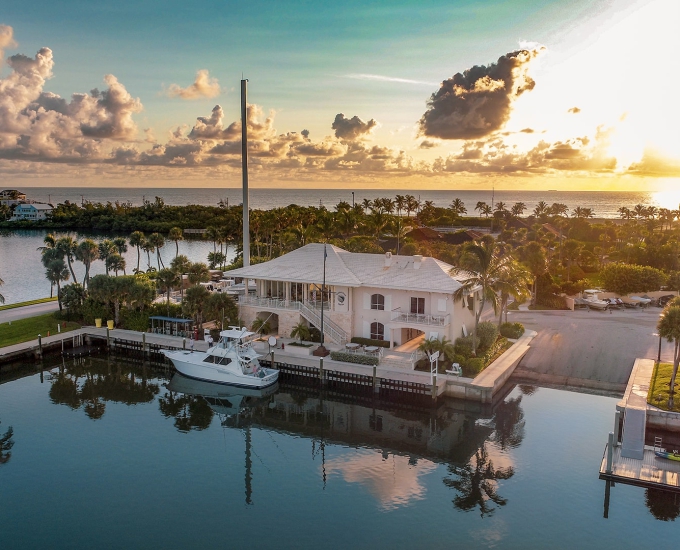 aerial view of the sailfish point yacht club at sunrise