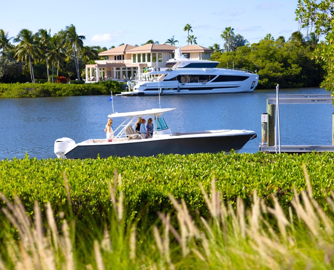 people pulling up to sailfish home by boat