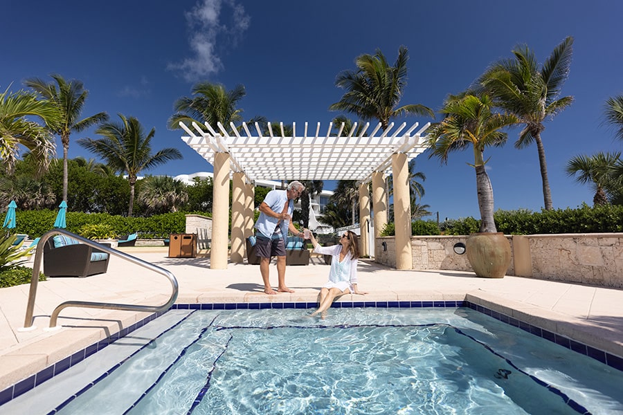 couple in sailfish point resort style pool