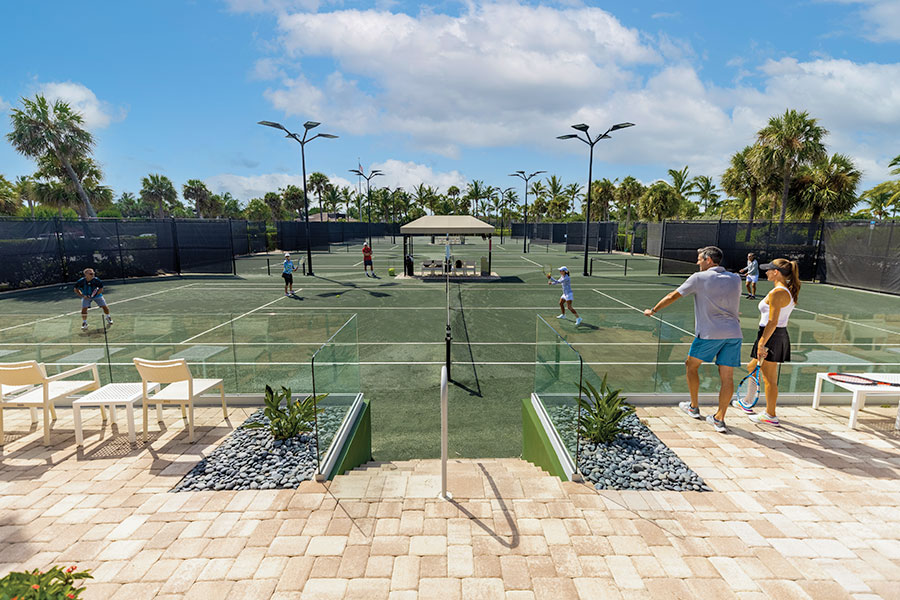 members playing tennis at sailfish point courts