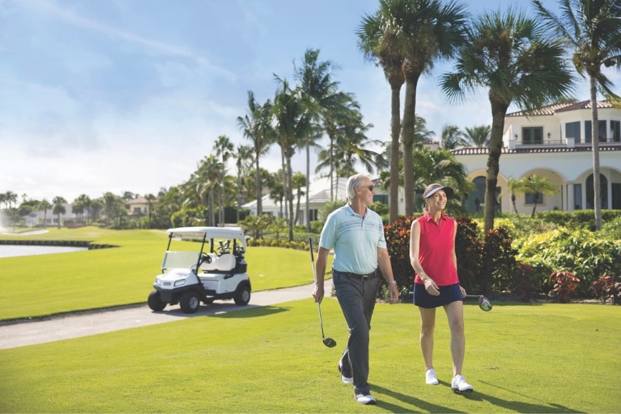 Couple on golf course at Sailfish Point