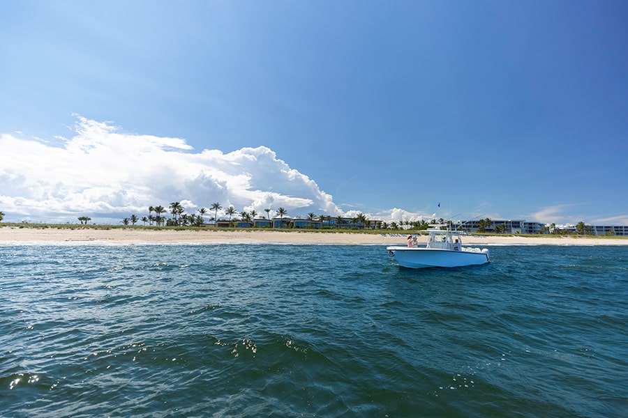 coastal destination boat infront of sailfish point