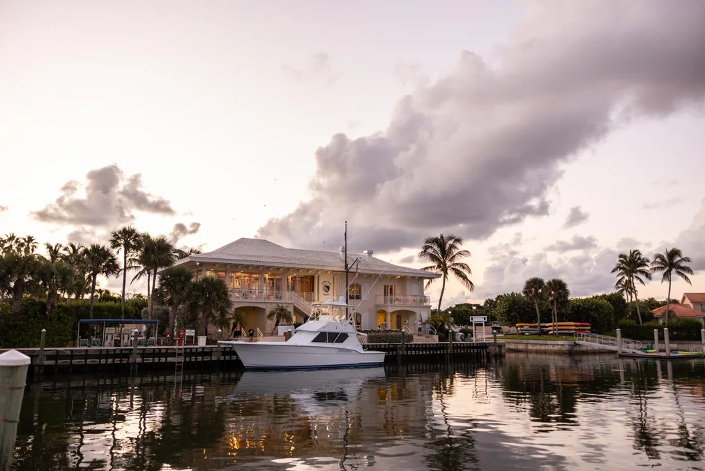 Private marina with yachts at golden hour in calm fall weather at Sailfish Point