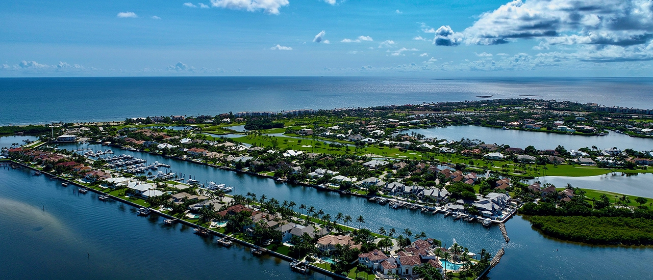 Aerial view of waterfront homes and marina channels