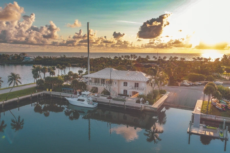 private dock and boat at sunset along a coastal canal.